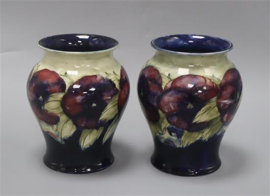 A pair of Moorcroft Pansy vases height 17cm